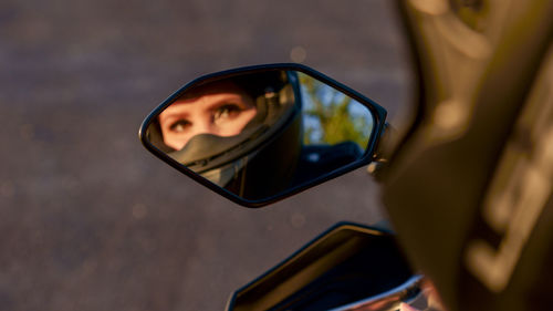 Reflection of woman wearing sunglasses