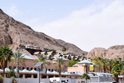 Hotel resort against rocky mountains