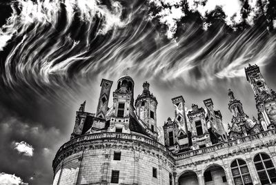 Low angle view of cathedral against cloudy sky