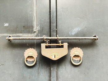 Close-up of padlock on metal door