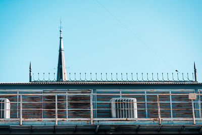 Low angle view of building against clear blue sky