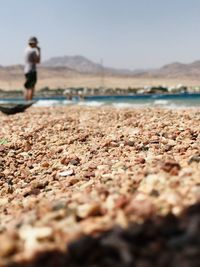 Surface level of beach against sky