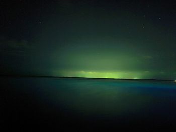 Scenic view of sea against sky at night