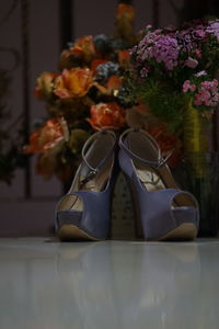 Close-up of shoes on table