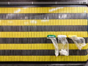 Garbage bags on tiled wall