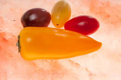 Close-up of yellow slices over white background