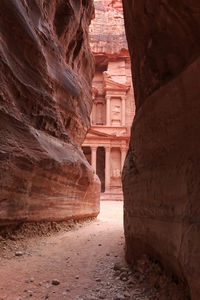 Narrow walkway amidst rock formations