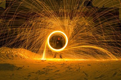 Light painting on sand at beach