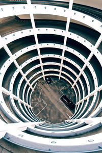 From above of spiral shaped car parking with curved lines located in hamburg