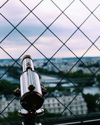 Close-up of metal bridge against sky