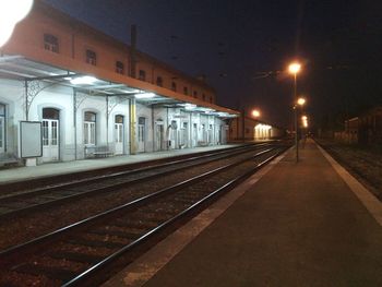 View of railroad station platform at night