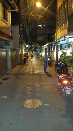 Street in illuminated city at night