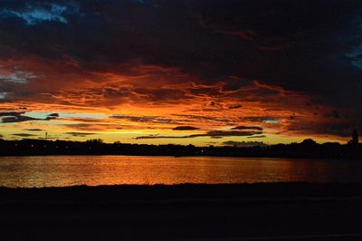 Scenic view of calm lake at sunset