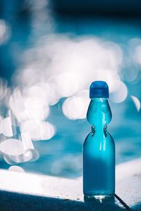 Close-up of glass bottle on table