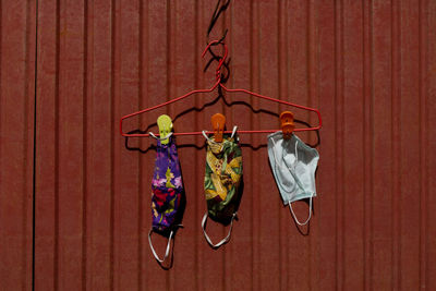 Clothes drying on clothesline against wall