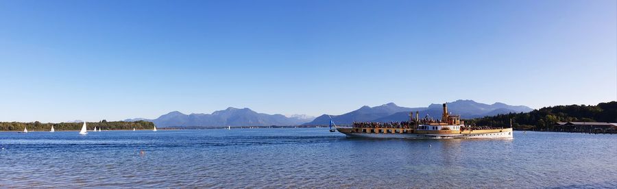 Scenic view of sea against clear blue sky