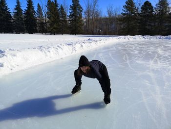 Full length of woman on snow covered field