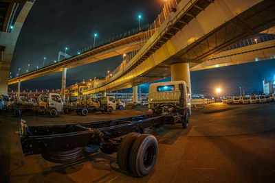 Illuminated bridge against sky at night