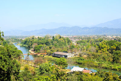 Scenic view of trees and mountains against sky