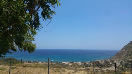 Scenic view of sea against clear blue sky