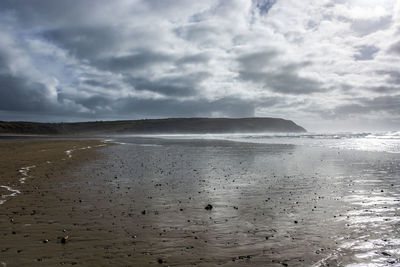 Scenic view of beach against sky