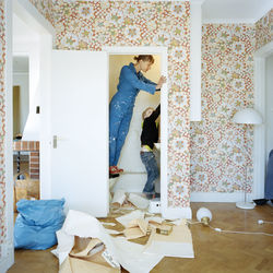 Mother and son renovating bathroom