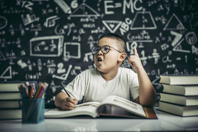 Young man sitting on table