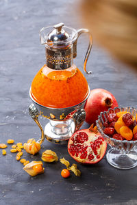 Close-up of fruits in jar on table