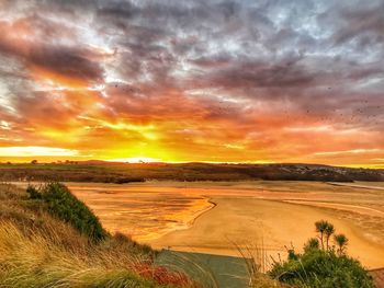 Scenic view of dramatic sky over land