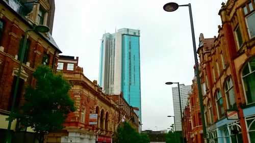 Low angle view of modern building against sky