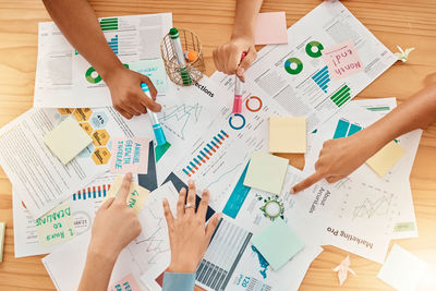 High angle view of business colleagues working on table