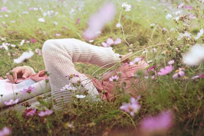 Woman lying down on field