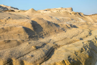 Scenic view of desert against clear sky