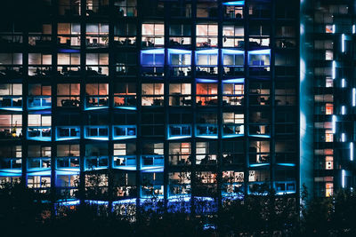 Full frame shot of illuminated buildings in city at night