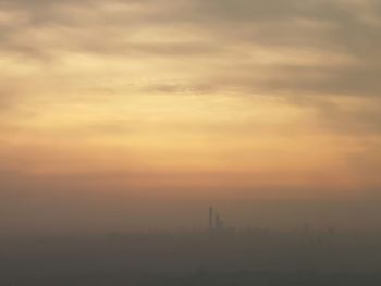 Scenic view of silhouette landscape against sky during sunset