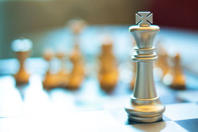 Close-up of chess pieces on table