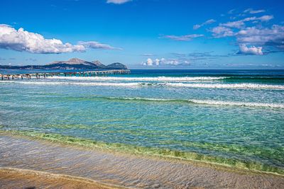 Scenic view of sea against blue sky