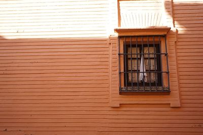 Close-up of window on brick wall