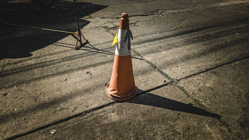 High angle view of umbrella on street during sunny day