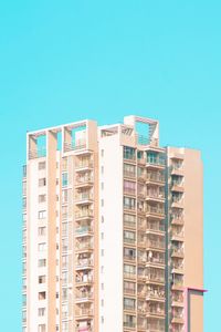 Low angle view of buildings against blue sky