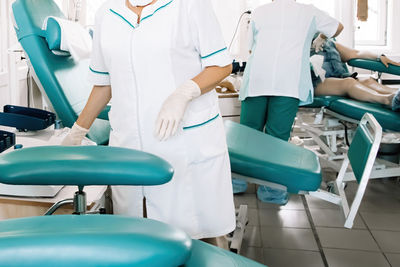 Midsection of nurse at blood donation camp