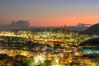 High angle view of illuminated buildings against sky at sunset