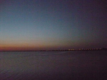 Scenic view of sea against sky at sunset