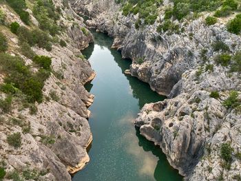High angle view of river amidst rocks