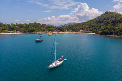 High angle view of sailboat sailing on sea against sky