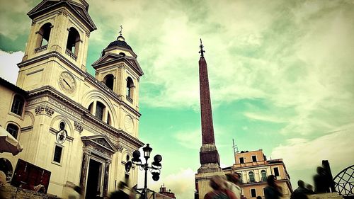 Low angle view of church against cloudy sky