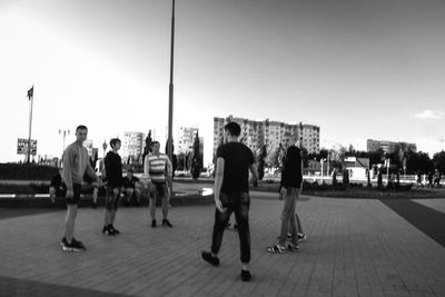 People standing on street in city