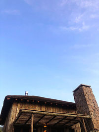 Low angle view of building against clear blue sky