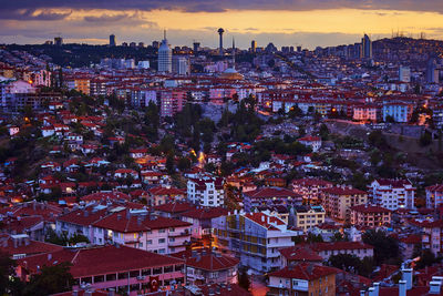 High angle view of illuminated cityscape against sky