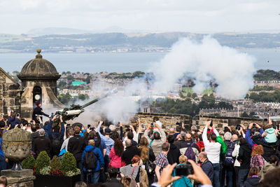 People at temple against sky